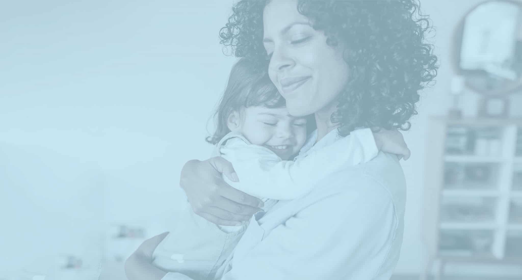 mom and daughter hugging